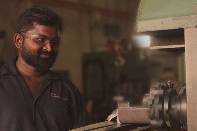 Parijatha Machinery worker operating equipment in the workshop